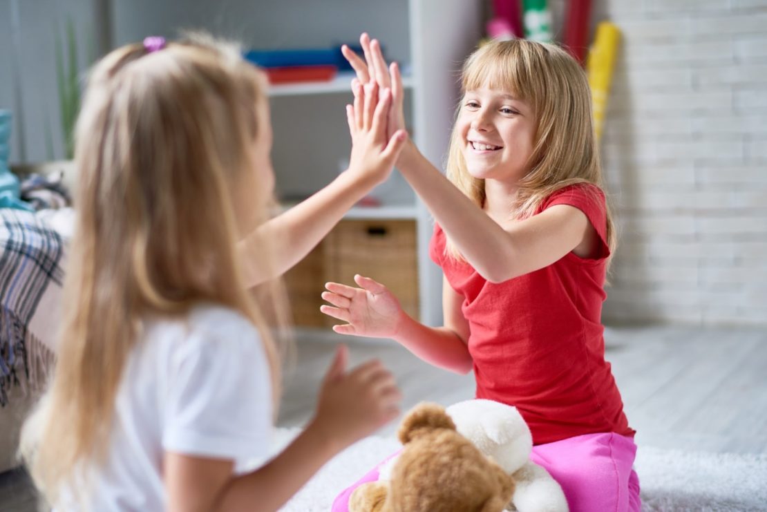 two young girls happy after having anxiety therapy