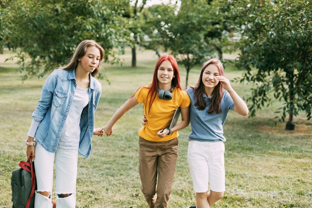 teen with friends after depression therapy