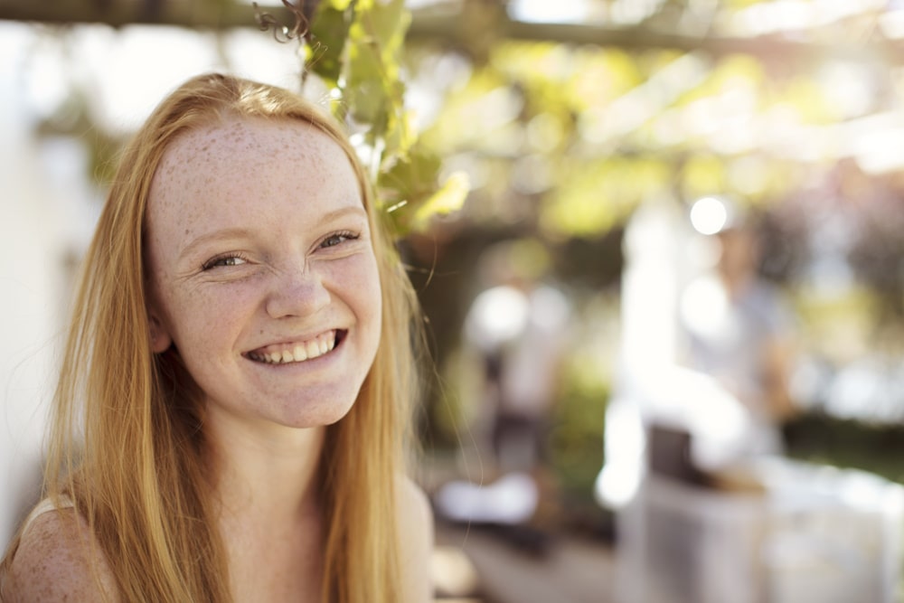smiling teenage girl after depression therapy