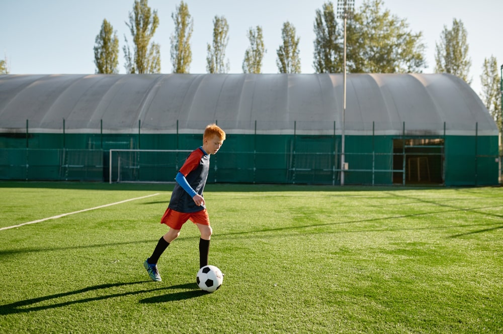 child playing football after depression therapy