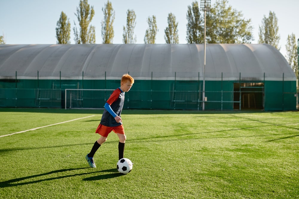 child playing football after depression therapy