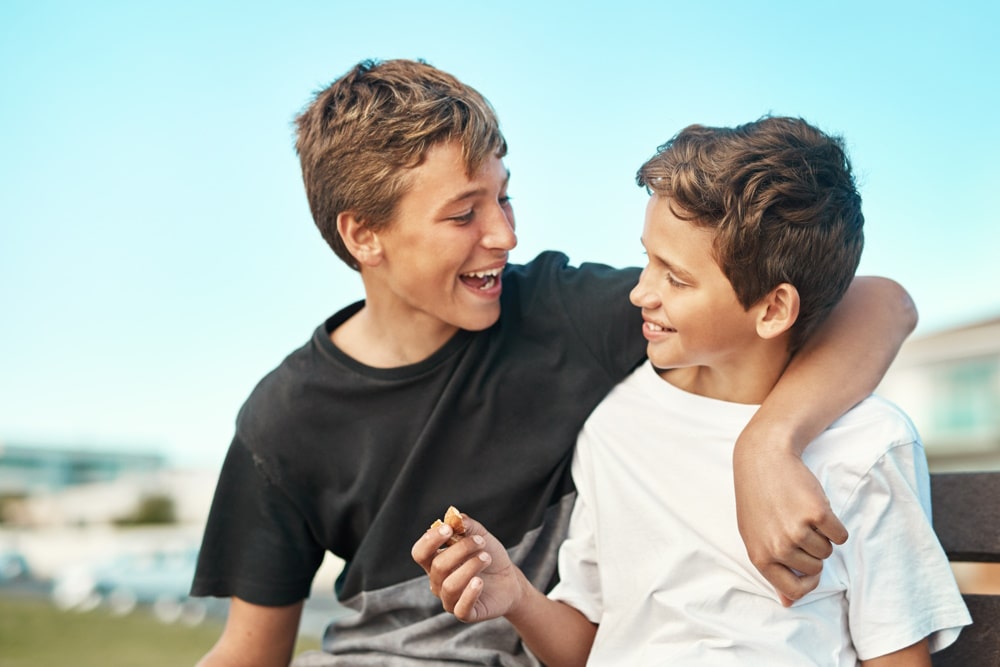 Low resilience, two children hugging and smiling