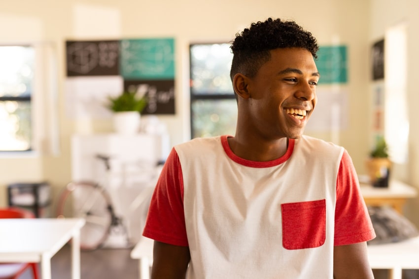teenage boy smiling to his friend after therapy in Burgess Hill