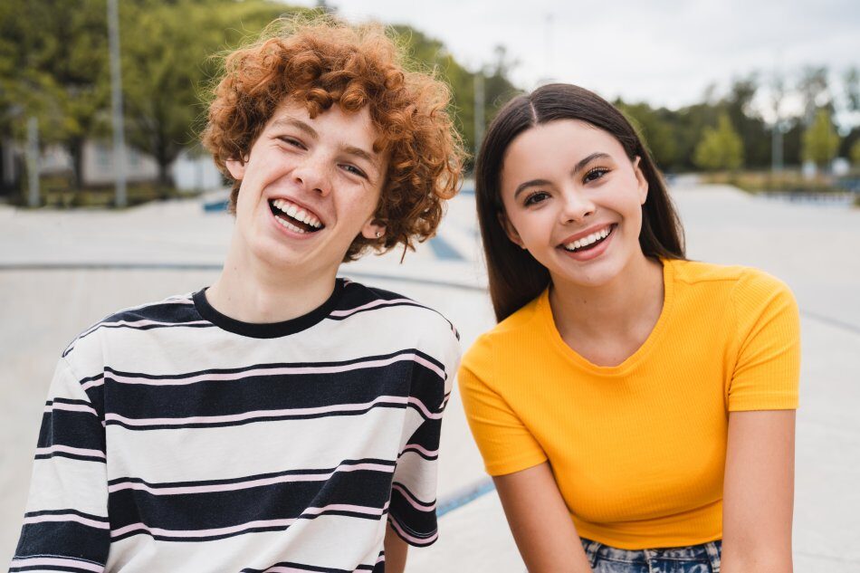 teenagers smiling together at skate park after therapy in kilmarnock